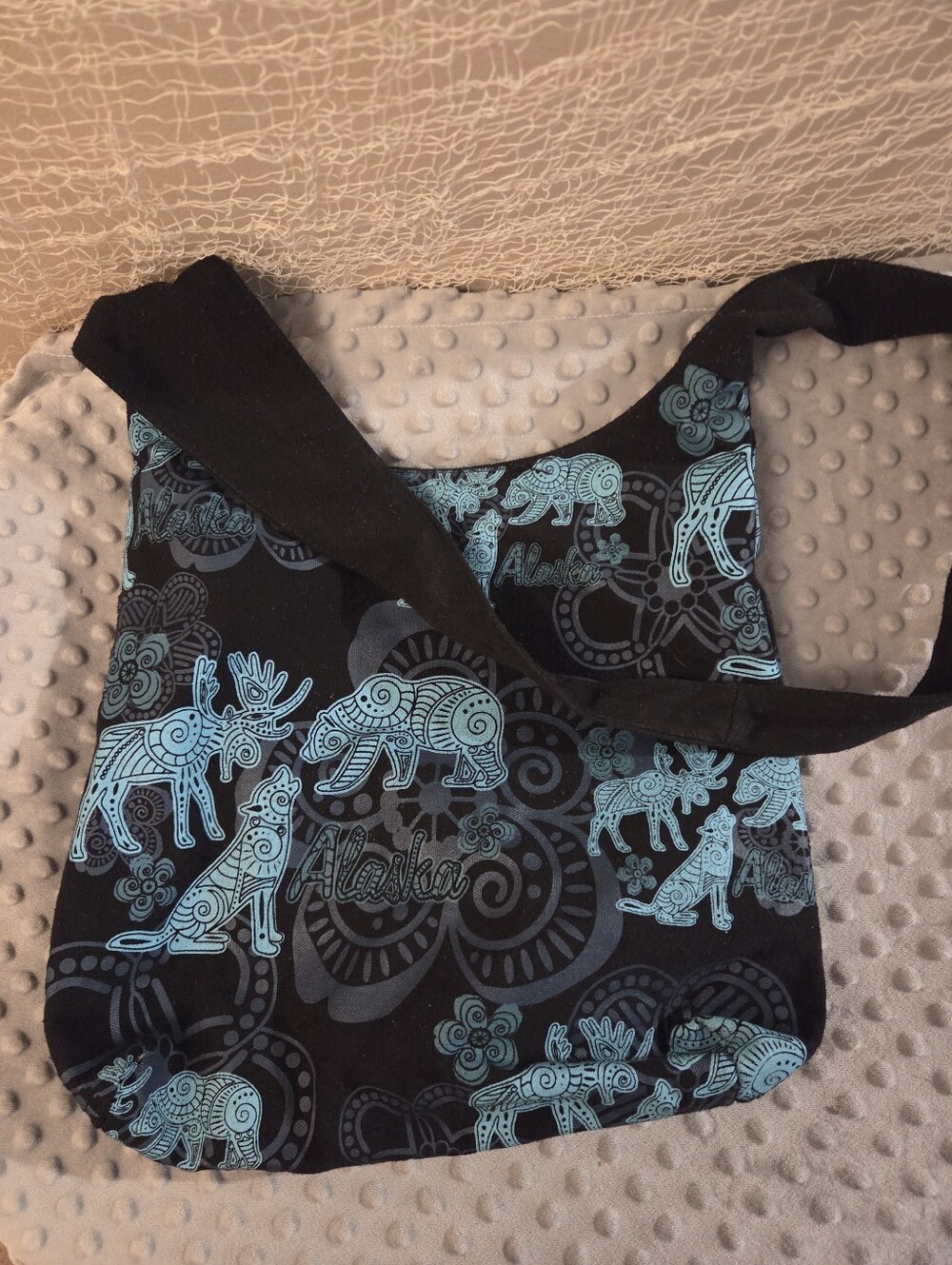 Blue & black purse with animals from Alaska wolf moose bear